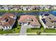 Luxury home with solar panels and paver driveway, situated on a lake at 8731 Sanders Tree Loop, Wesley Chapel, FL 33545