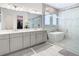 Spa-like bathroom with double vanity, soaking tub, and walk-in shower at 8731 Sanders Tree Loop, Wesley Chapel, FL 33545