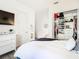 Bedroom with walk in closet, TV, and white dresser at 8731 Sanders Tree Loop, Wesley Chapel, FL 33545