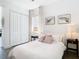 Comfortable bedroom with double closet and wood-look floors at 8731 Sanders Tree Loop, Wesley Chapel, FL 33545