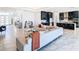 Bright living room with open concept kitchen and marble floors at 8731 Sanders Tree Loop, Wesley Chapel, FL 33545