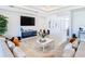 Spacious living room featuring comfortable seating and a modern aesthetic at 8731 Sanders Tree Loop, Wesley Chapel, FL 33545
