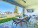 Outdoor patio with seating area, perfect for relaxing and entertaining at 8731 Sanders Tree Loop, Wesley Chapel, FL 33545