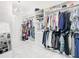 Luxurious Primary closet featuring abundant storage and a full-length mirror at 8731 Sanders Tree Loop, Wesley Chapel, FL 33545