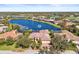 Lakefront luxury home with lush landscaping at 7925 Royal Queensland Way, Lakewood Ranch, FL 34202