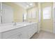 Double vanity bathroom with large mirror at 7925 Royal Queensland Way, Lakewood Ranch, FL 34202