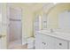 Bathroom with shower, toilet and white vanity at 7925 Royal Queensland Way, Lakewood Ranch, FL 34202