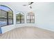 Bedroom with lake view and neutral decor at 7925 Royal Queensland Way, Lakewood Ranch, FL 34202