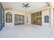Spacious enclosed patio with pool access and a dartboard at 7925 Royal Queensland Way, Lakewood Ranch, FL 34202