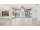 Gathering room with multiple windows, views of the pool and lake at 7925 Royal Queensland Way, Lakewood Ranch, FL 34202