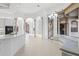 Modern kitchen with island and white cabinetry at 7925 Royal Queensland Way, Lakewood Ranch, FL 34202