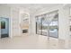 Living area with fireplace, built-ins, and access to the pool area at 7925 Royal Queensland Way, Lakewood Ranch, FL 34202