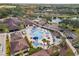 Community pool with lounge area and umbrellas at 7925 Royal Queensland Way, Lakewood Ranch, FL 34202