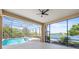 Relaxing pool and spa with screened enclosure and lake view at 7925 Royal Queensland Way, Lakewood Ranch, FL 34202