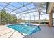 Enclosed pool and spa with lake view at 7925 Royal Queensland Way, Lakewood Ranch, FL 34202