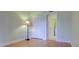 Bedroom with hardwood floors, a closet, and access to a bathroom at 1001 Tartan Dr # 207, Palm Harbor, FL 34684