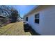 Side yard view, showing a grassy area and wooden fence at 1146 81St N Ave, St Petersburg, FL 33702