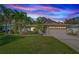 Charming single-story home featuring lush landscaping, a two-car garage, and a well-manicured front lawn at 2342 Hazelwood Ln, Clearwater, FL 33763