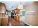 Spacious kitchen showcasing wood cabinets, laminate flooring, granite counters, and stainless appliances at 2342 Hazelwood Ln, Clearwater, FL 33763