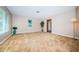 Spacious living room with neutral paint, large window, and decorative plants at 2342 Hazelwood Ln, Clearwater, FL 33763