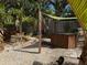 Outdoor kitchen and dining area with tropical landscaping at 2716 Miriam S St, Gulfport, FL 33711