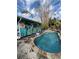 Relaxing kidney shaped pool with tropical mural and landscaping at 2716 Miriam S St, Gulfport, FL 33711