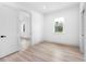 Simple bedroom with light walls and wood-look floors at 7306 Exter Way, Tampa, FL 33615