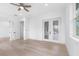 Bedroom with wood-look floors and private balcony access at 7306 Exter Way, Tampa, FL 33615