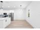 Bright dining area with hardwood floors and modern light fixture at 7306 Exter Way, Tampa, FL 33615