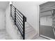 Interior view of garage entry with modern staircase at 7306 Exter Way, Tampa, FL 33615