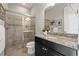 Bathroom featuring a tiled shower and granite countertops at 10111 Craftsman Park Way, Palmetto, FL 34221