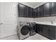 Laundry room with new appliances and custom cabinetry at 10111 Craftsman Park Way, Palmetto, FL 34221