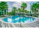 Relaxing circular pool with surrounding patio at 14929 Promenade Pkwy, Odessa, FL 33556