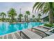 Modern pool with plenty of lounge chairs at 14929 Promenade Pkwy, Odessa, FL 33556