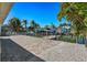 Large paved patio area with a view of the canal at 17710 Long Point Dr, Redington Shores, FL 33708