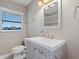 Small bathroom with a toilet and vanity at 17710 Long Point Dr, Redington Shores, FL 33708