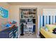 Built-in shelves and desk provide a workspace in this bright bedroom at 17710 Long Point Dr, Redington Shores, FL 33708