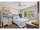 Bedroom with a queen-size bed and built-in shelving at 17710 Long Point Dr, Redington Shores, FL 33708