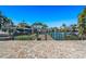 Wooden dock with access to the canal, and boats at 17710 Long Point Dr, Redington Shores, FL 33708