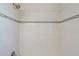 Shower with white tile and mosaic trim at 17710 Long Point Dr, Redington Shores, FL 33708