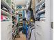 Spacious walk-in closet with ample shelving and drawers at 17710 Long Point Dr, Redington Shores, FL 33708