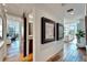 Modern hallway with hardwood floors and artwork, offering views to an office and bathroom at 226 5Th N Ave # 1406, St Petersburg, FL 33701