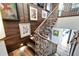 Modern staircase featuring a metal railing and wood steps at 226 5Th N Ave # 1406, St Petersburg, FL 33701