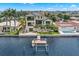 Modern waterfront home features a private dock and stunning canal views at 7949 2Nd S Ave, St Petersburg, FL 33707