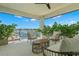 Peaceful balcony overlooking the water with comfortable seating at 7949 2Nd S Ave, St Petersburg, FL 33707