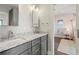 Modern bathroom with double vanity and granite countertop at 7949 2Nd S Ave, St Petersburg, FL 33707