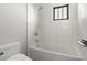 Clean bathroom with a shower/tub combo and modern fixtures at 7949 2Nd S Ave, St Petersburg, FL 33707