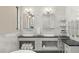 Elegant bathroom with double vanity and marble tile at 7949 2Nd S Ave, St Petersburg, FL 33707