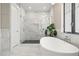 Spa-like bathroom with walk-in shower and soaking tub at 7949 2Nd S Ave, St Petersburg, FL 33707