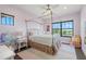 Charming bedroom with a canopy bed, a unicorn wall decal, and hardwood floors at 7949 2Nd S Ave, St Petersburg, FL 33707